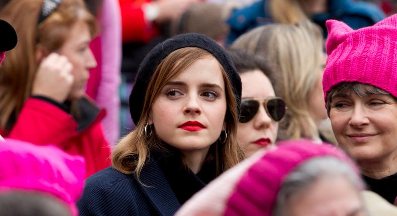 Actress Emma Watson sits with the crowd during the Women's March on Washington, Saturday, Jan. 21, 2017 in Washington.