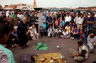 Arab Storyteller and crowd, Djemma el Fna Square Marrakech Morocco Africa