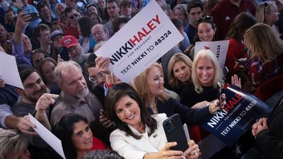 Former South Carolina governor turned 2024 Republican presidential candidate Nikki Haley takes a selfie with supporters at her first campaign event on February 15, 2023 in Charleston, South Carolina.Win McNamee/Getty Images