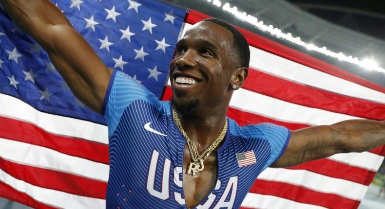 US Gil Roberts celebrates winning the Men's 4x400m Relay Final during the athletics event at the Rio 2016 Olympic Games at the Olympic Stadium in Rio de Janeiro on August 20, 2016