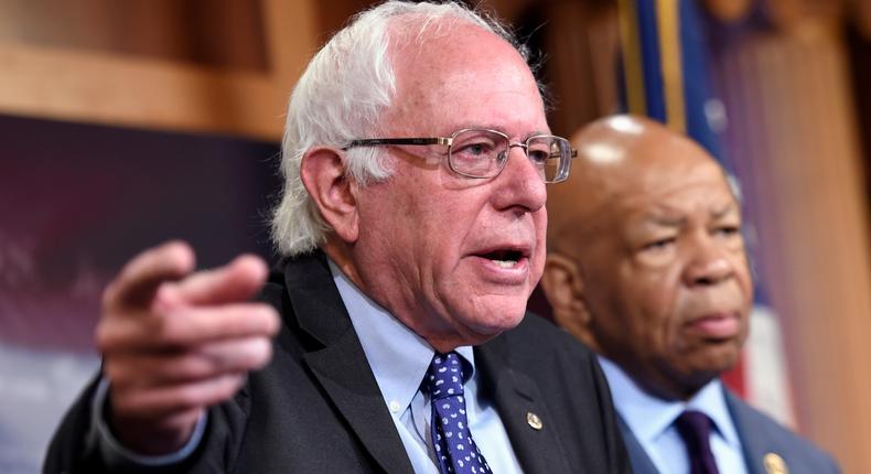 Democratic presidential candidate Sen. Bernie Sanders, I-Vt., left, accompanied by Rep. Elijah Cummings, D-Md., speaks during a news conference on the cost of prescription drugs, Thursday, Sept. 10, 2015, on Capitol Hill in Washington.