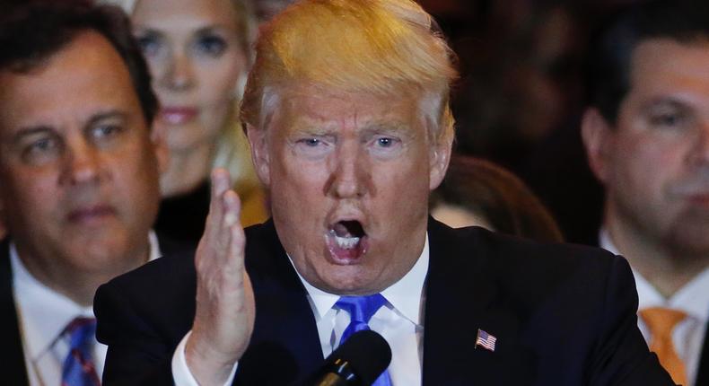 Republican U.S. presidential candidate Donald Trump speaks, as New Jersey Governor Chris Christie (L) looks on, during Trump's five state primary night event in New York City, U.S., April 26, 2016.