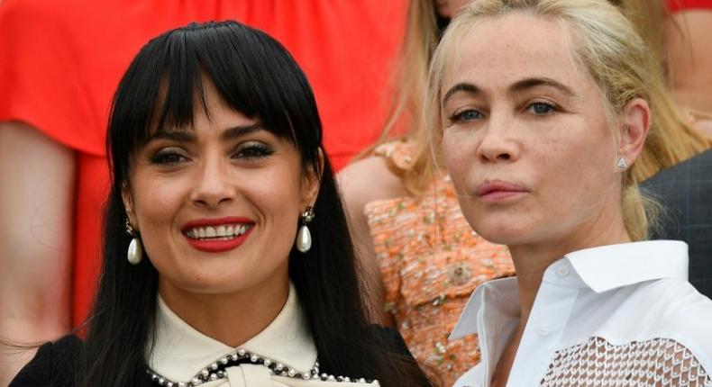 US-Mexican actress Salma Hayek (L) and French actress Emmanuelle Beart pose on May 23, 2017 during a photocall for the '70th Anniversary' of the Cannes Film Festival