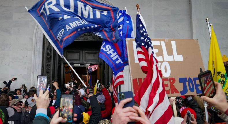 In this Jan. 6, 2021, file photo, Trump supporters gather outside the Capitol in Washington. Some people charged with storming the U.S. Capitol on Jan. 6 are claiming they were only there to record history as journalists, not join a deadly insurrection.
