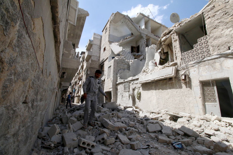 Residents inspect damage after an airstrike on the rebel held al-Maysar neighborhood in Aleppo, Syria, on April 11.
