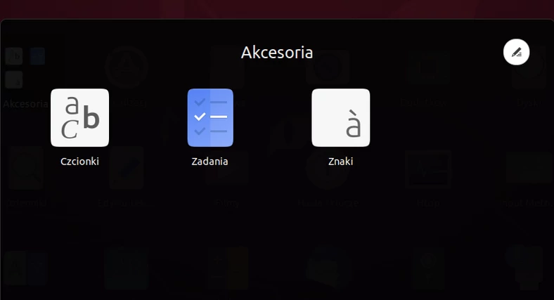 W celu utworzenia katalogu z aplikacjami należy w Launcherze Ubuntu przeciągnąć jedną ikonę na drugą. Folder zostanie utworzony automatycznie. Możemy dostosować jego nazwę, klikając na symbol długopisu w prawym górnym rogu
