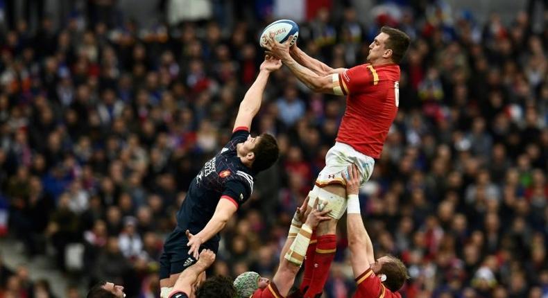 Wales' flanker Sam Warburton (up R) catches the ball in a line-out during the Six Nations tournament Rugby Union match between France and Wales at the Stade de France in Saint-Denis, outside Paris, on March 18, 2017