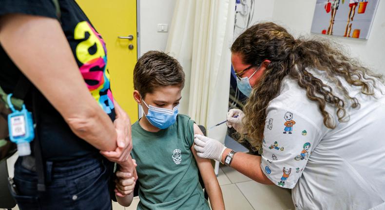 A boy receives the Pfizer COVID-19 vaccine in the Israeli city of Holon, near Tel Aviv, on June 21.
