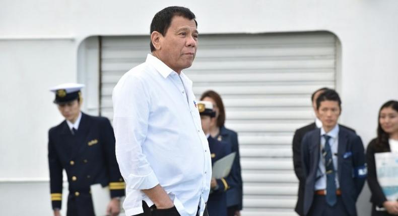 Philippine President Rodrigo Duterte inspects Japan's coast guard drills in Yokohama on October 27, 2016