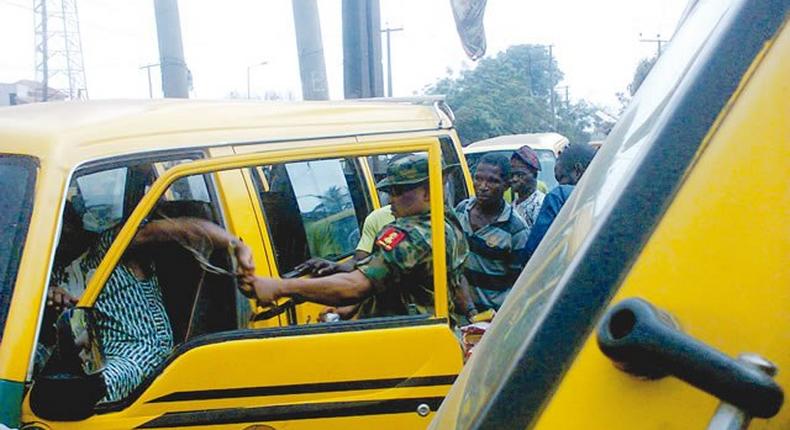 The soldier brutalising the bus driver