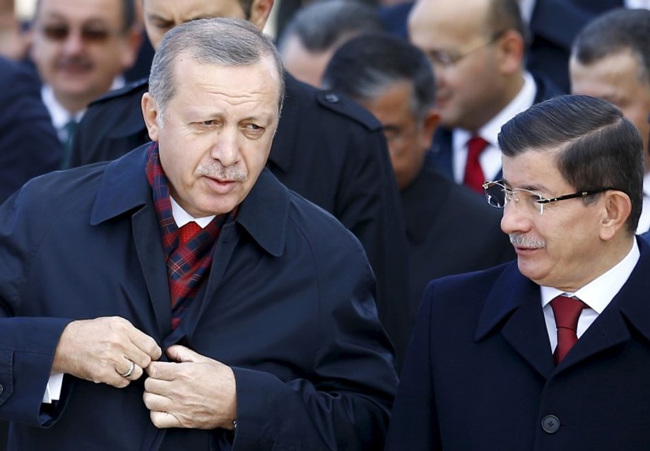 Turkey's President Erdogan chats with Prime Minister Davutoglu during a Republic Day ceremony at Anitkabir, the mausoleum of modern Turkey's founder Ataturk, in Ankara, Turkey.