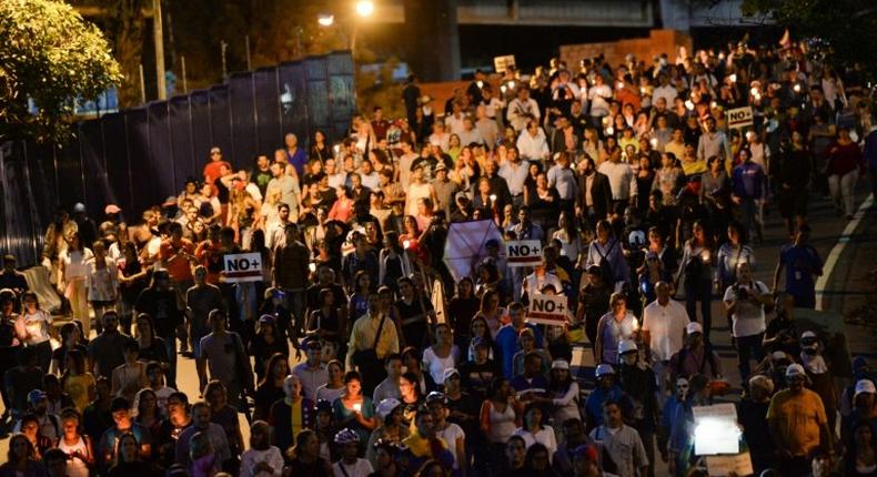 Opposition demonstrators march towards OAS headquarters in Caracas after the OAS General Assembly rules out issuing a resolution on the crisis in Venezuela