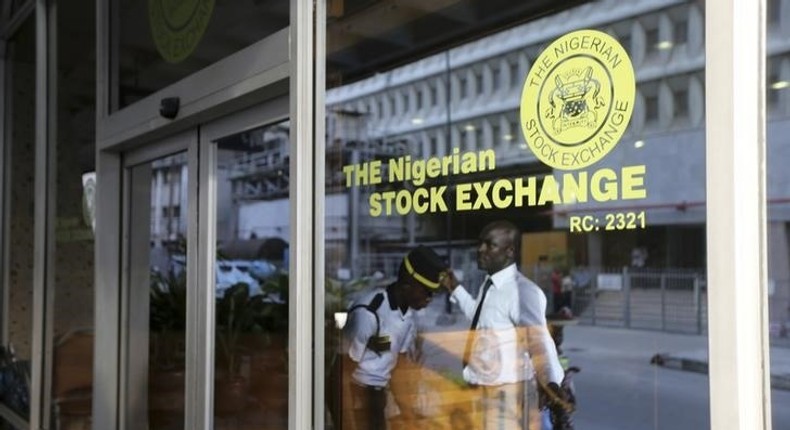 A security officer checks a man outside the Nigerian Stock Exchange in Lagos April 8, 2014.    REUTERS/Akintunde Akinleye