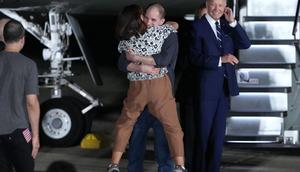 Freed journalist Evan Gershkovich embracing his mother Ella Milman after arriving at Joint Base Andrews.Andrew Harnik via Getty Images