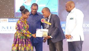 Elizabeth Ochieng' receives her Journalist of the Year award on May 3, 2024