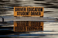 The roof a student driver car is pictured partly underwater as a result of Hurricane Matthew in Lumberton