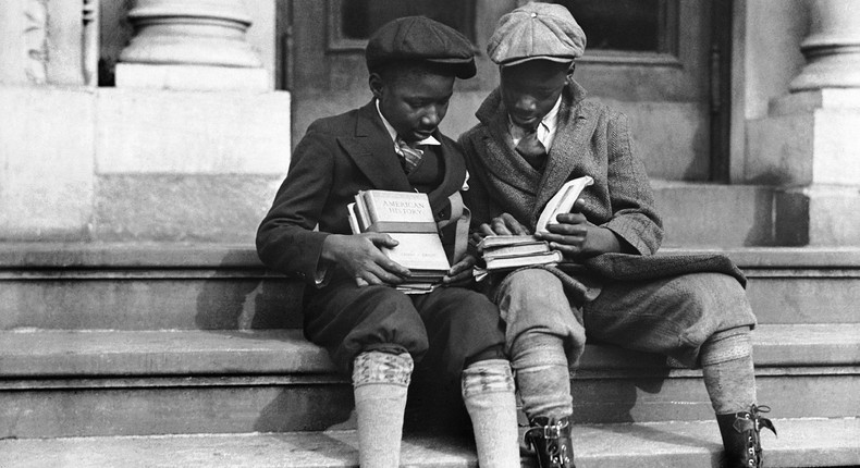 Two boys sit together in Harlem in 1933.Keystone-France/Getty Images