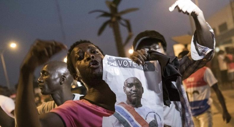 People celebrate the inauguration of new Gambia's President Adama Barrow at Westfield neighbourhood on January 19, 2017 in Banjul