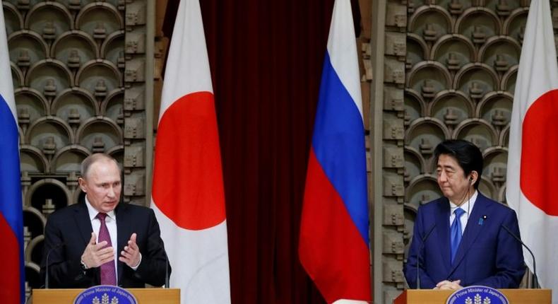 Russian President Vladimir Putin (L) and Japanese Prime Minister Shinzo Abe end a two-day summit with no deal over disputed islands