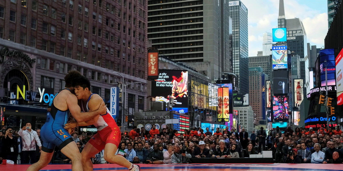 Andy Bisek of the US, in blue, faced off with Kim Hyeon-Woo of South Korea in the Greco-Roman 165-pound "Beat the Streets" event in New York City's Times Square.