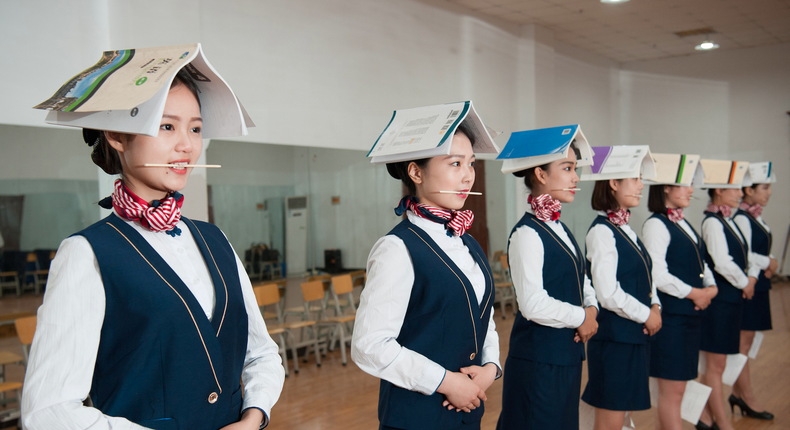 Students training to be flight attendants seen during a standing posture practice at a vocational school in Shijiazhuang, in China’s Hebei province.