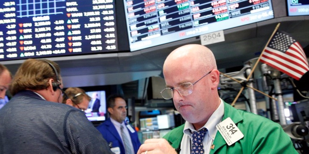 Traders work on the floor of the NYSE