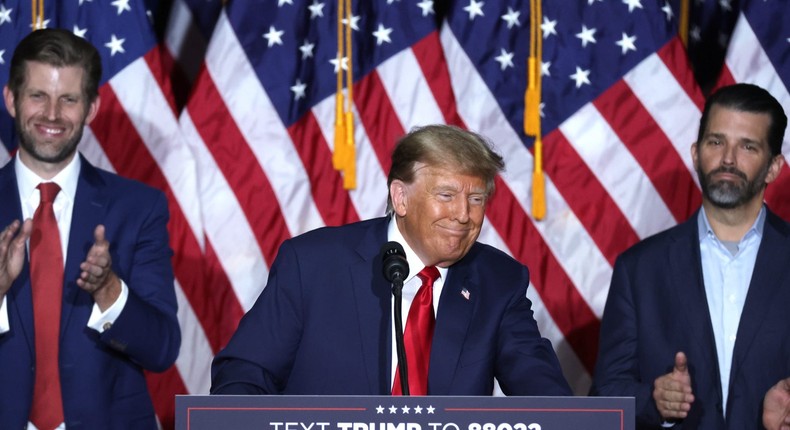 DES MOINES, IOWA - JANUARY 15: Former President Donald Trump speaks at his caucus night event, with sons Eric Trump and Donald Trump Jr. looking on, at the Iowa Events Center on January 15, 2024 in Des Moines, Iowa. Iowans voted today in the state's caucuses for the first contest in the 2024 Republican presidential nominating process. Trump has been projected winner of the Iowa caucus.Alex Wong/Getty Images