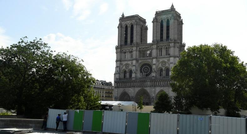 Workers installed fencing around Notre-Dame Cathedral in August as they began lead clean-up operations