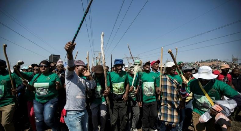 Members of the Association of Mineworkers and the Marikana community mark the fifth anniversary of the Marikana massacre on August 16, 2017