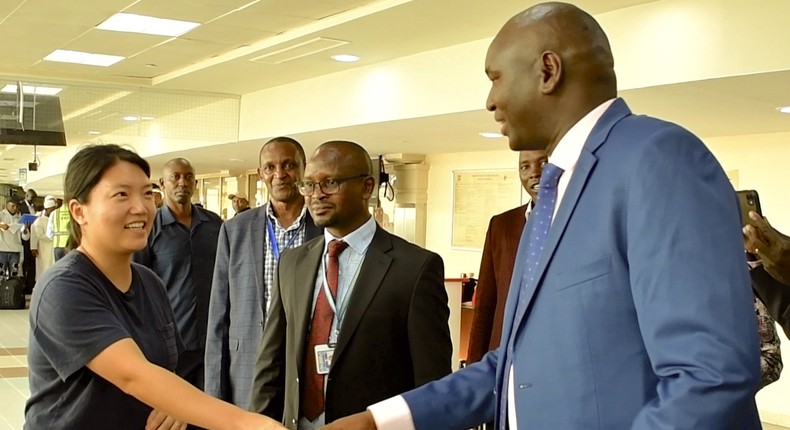 Immigration PS Julius Bitok meets Ms Kyung Sang Yoo, who was among the first visa-free travellers to Kenya