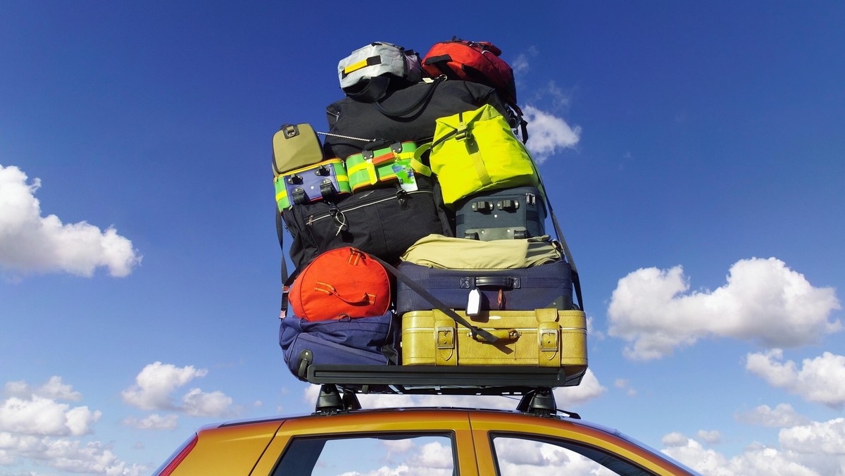 Luggage stacked on car roofrack, low angle view