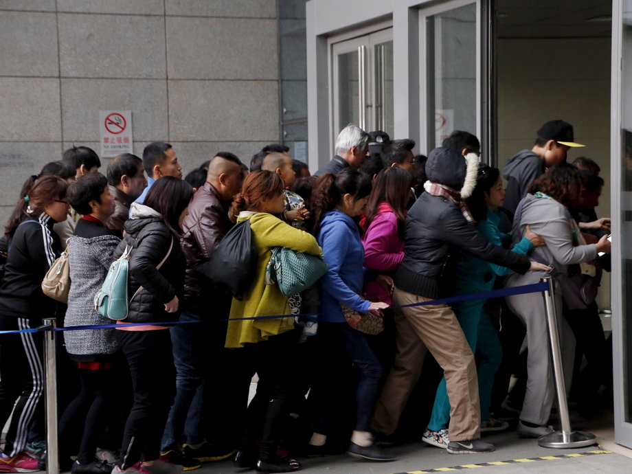 People rush into Peking Union Hospital in Beijing, China, early on April 6.