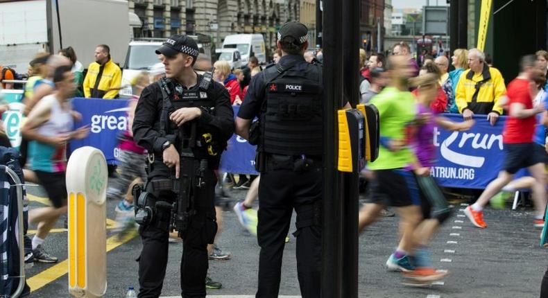 Some 40,000 runners are taking part in the annual half marathon through Manchester which is being held under tight security with armed police along the route