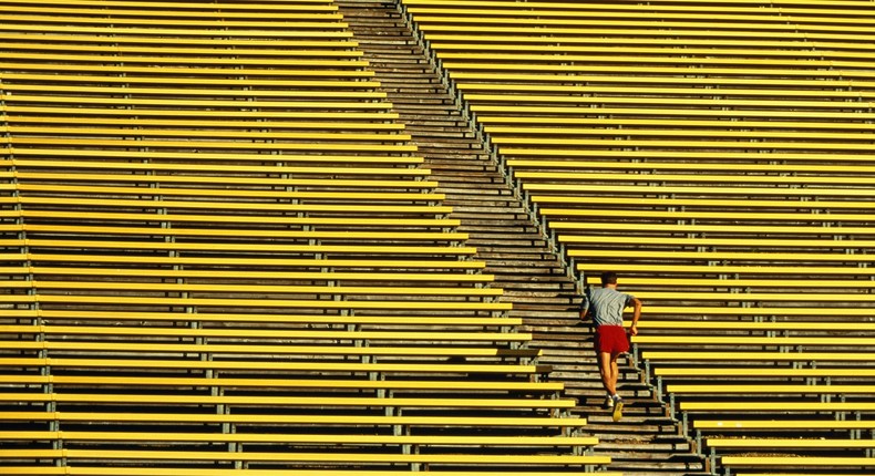 Start out with a 10 to 20-minute warm up followed by two full minutes of stair running.David Madison / Getty Images