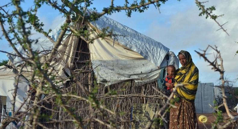 A Somali refugee woman with her child at Kenya's Dadaab refugee camp