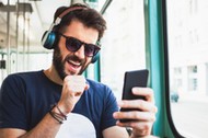 Young commuter listening to the music