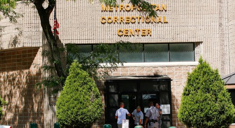 FILE PHOTO: Security personnel and people are seen at the entrance of the Metropolitan Correctional Center jail where financier Jeffrey Epstein was found dead in the Manhattan borough of New York City, New York, U.S., August 12, 2019. REUTERS/Eduardo Munoz/File Photo