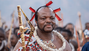 King Mswati III, who took the throne in 1986, arrives in ceremonial dress for the annual reed dance. Photograph: Emmanuel Croset/AFP/Getty Images