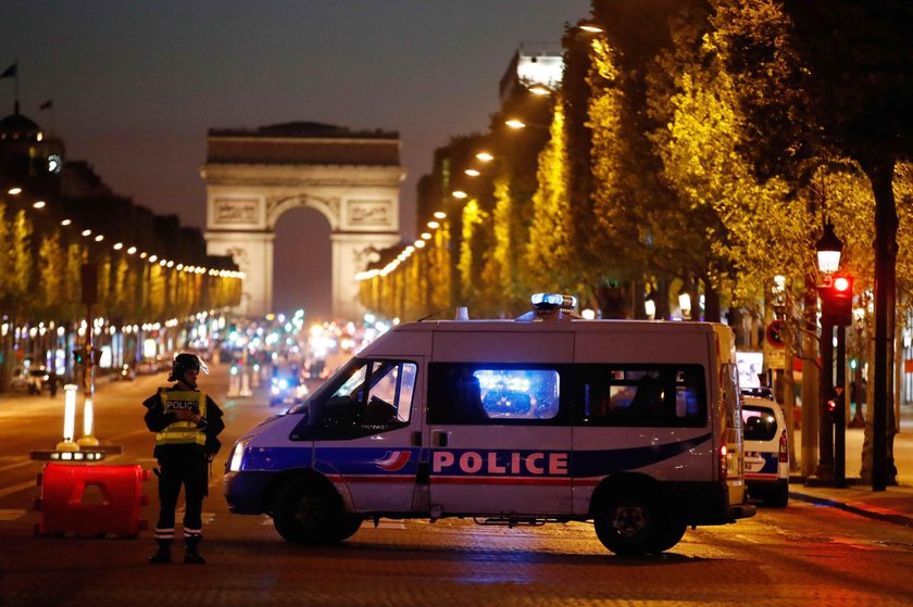 Police secure the Champs Elysees Avenue after one policeman was killed and another wounded in a shoo