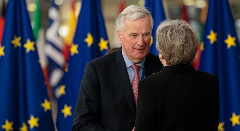 The EU's chief Brexit negotiator Michel Barnier greets UK Prime Minister Theresa May.