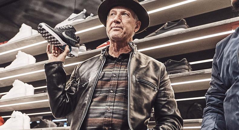 Tinker Hatfield, Nike's VP of innovation and special projects, holding the Nike HyperAdapt 1.0.