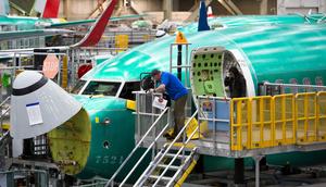 Employees working on a Boeing 737 Max at the factory in Renton, Washington.JASON REDMOND/AFP via Getty Images