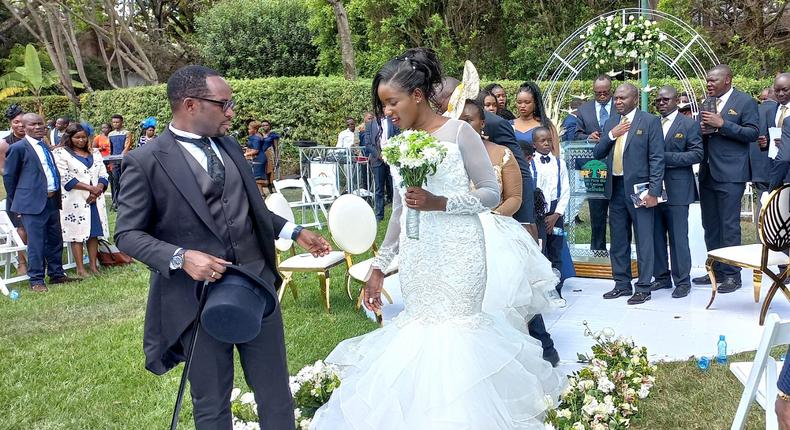 Silas Jakakimba and his bride Florence during their wedding held at the Safari Park Hotel in Nairobi on October 16, 2021