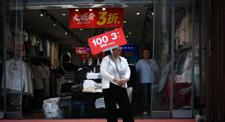 Chinese retailers are increasingly trying to entice customers in with discounts.Wang Zhao/AFP/Getty Images