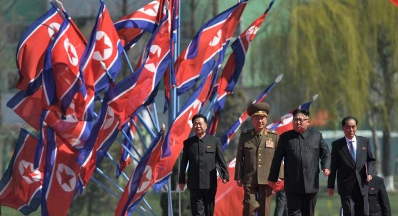 Tens of thousands of soldiers, officials and citizens packed a plaza to await leader Kim Jong-Un's arrival