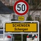 A street sign marks the beginning of the small Luxembourg village of Schengen