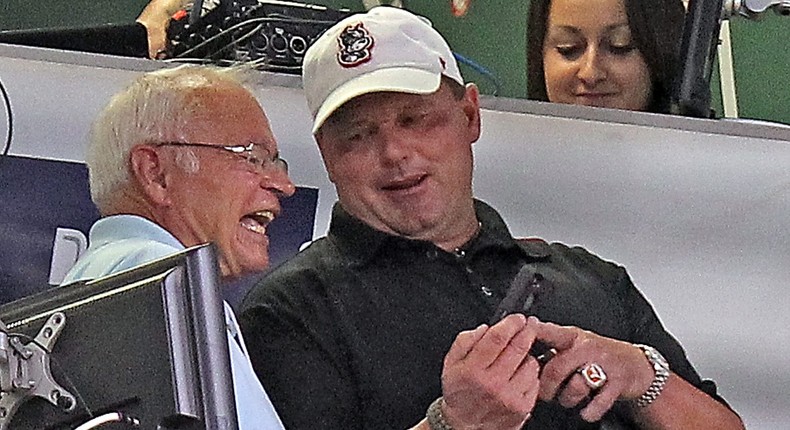 Boston Red Sox announcer Joe Castiglione (left) looks at a phone with Roger Clemens.Matt Stone/MediaNews Group/Boston Herald via Getty Images