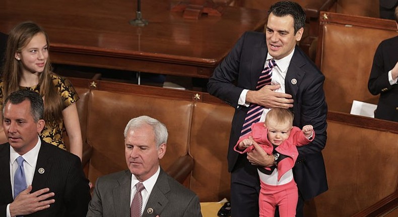 Rep. Kevin Yoder held his daughter Caroline Lucille Yoder while reciting the Pledge of Allegiance during the opening session of the 114th Congress.