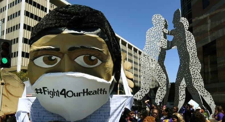 Protesters march outside the Federal Building during a Save the Affordable Care Act (Obamacare) rally in Los Angeles