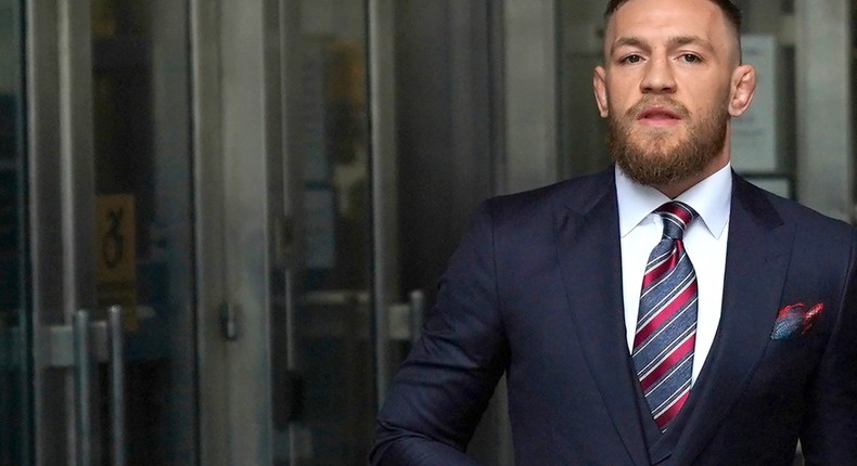 Irish mixed martial arts superstar Conor McGregor arrives to talk to the press after he pleaded guilty to a single violation of disorderly conduct, in Brooklyn Criminal Court on July 26, 2018. - The 30-year-old, who is nicknamed 'The Notorious,' had been charged with multiple counts of assault and criminal mischief after attacking a bus filled with UFC fighters at the Barclays Center. He pleaded guilty to a lesser charge of disorderly conduct in a fleeting court appearance, and was handed a punishment of five days' community service.